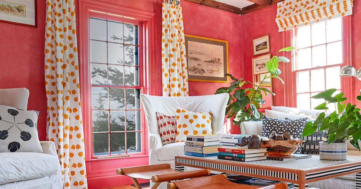 Coastal room painted in Nantucket Red with accent pillows and curtains from Laughing Gull Hill